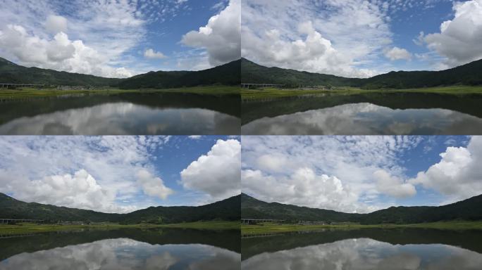 山间湖泊倒映蓝天白云的延时视频