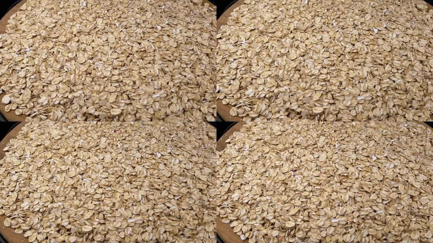 俯视图，堆干燕麦片缓慢旋转的背景燕麦片