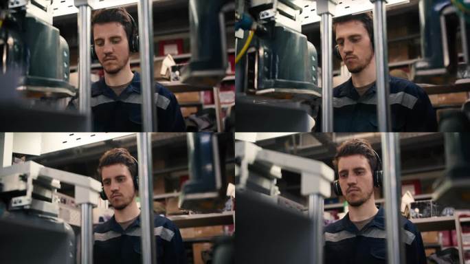 一个戴着黑色耳机的红发男子在一家服装厂的工业机器上工作的特写镜头。高质量拍摄