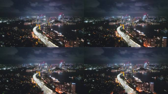 4K鸟瞰图实时拍摄悉尼海港大桥，环形码头，歌剧院和悉尼海港办公室和豪华大楼群在夜间的画面