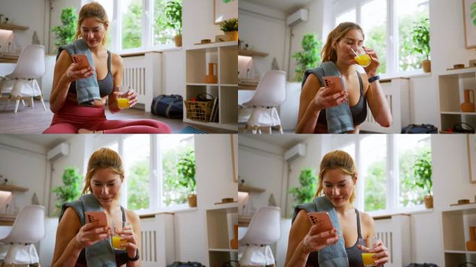 患有白癜风的高加索妇女，在家锻炼结束后，一边用手机一边喝橙汁
