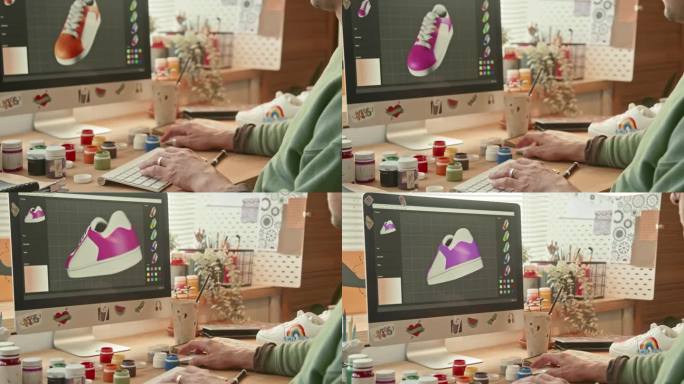 无法辨认的设计师在电脑中制作运动鞋的3D草图