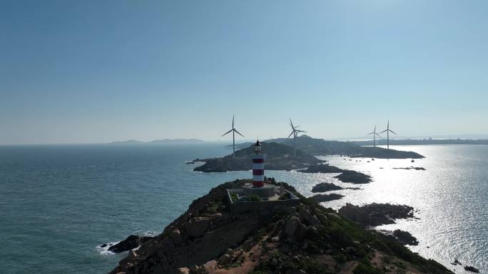 海上灯塔航拍海洋风车发电大海日出阳光海面