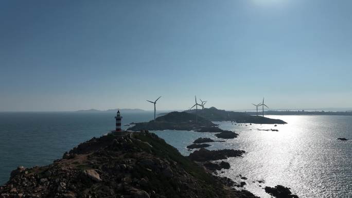 海上灯塔航拍海洋风车发电大海日出阳光海面