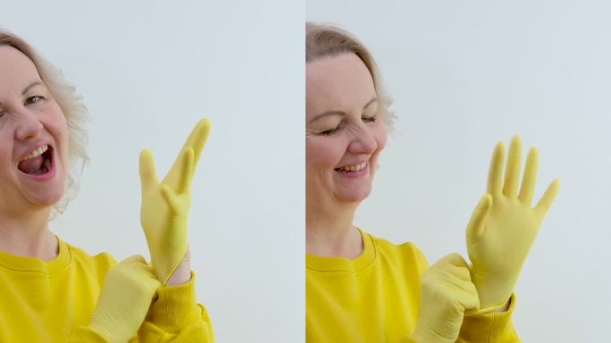 家庭主妇戴上黄色乳胶手套和蓝色背景的白色三聚氰胺海绵。通用工具，用于清洁各种表面的污垢和污渍