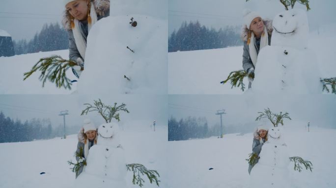 一个女人抱着她刚堆好的雪人