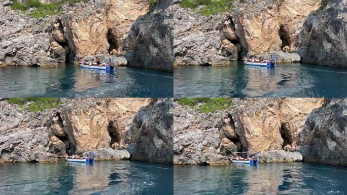 乘船游览附近的科孚岛景点深干净清澈的水山自然泉水乘船过往的人游客和旅客