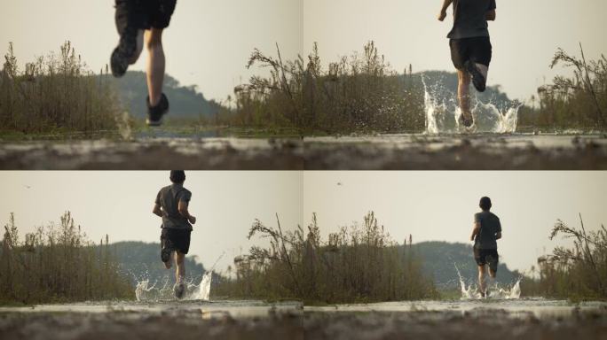 向前奔跑的人跑步背影河流浅水水花飞溅