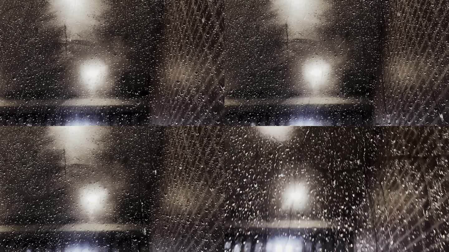 夜晚，雨点落在窗玻璃上，玻璃反射在室内的背景中。