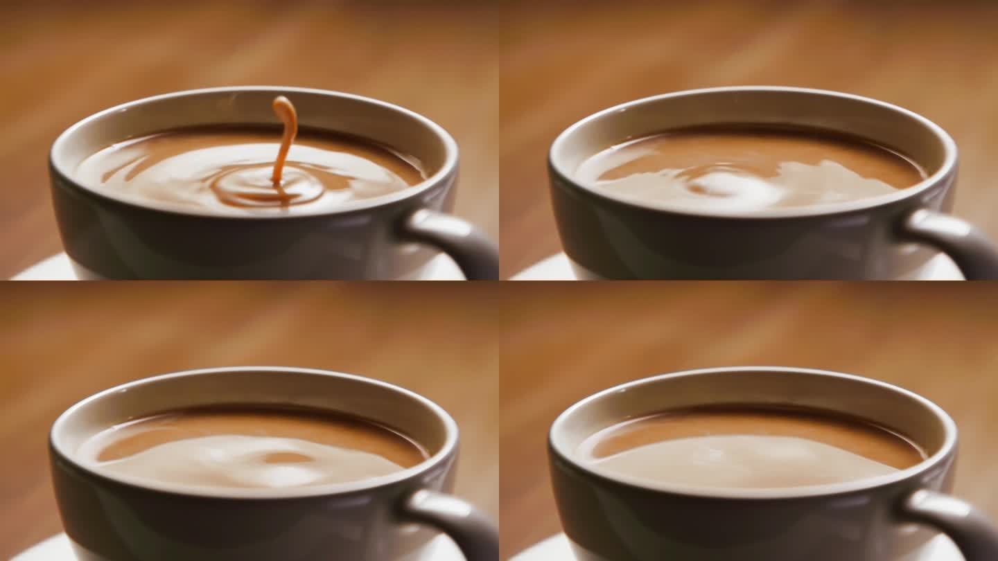 白色杯子里的咖啡。在意式咖啡屋酿造新鲜的阿拉比卡咖啡与牛奶奶油。准备有机酿造和饮用液体从甜点杯在工作