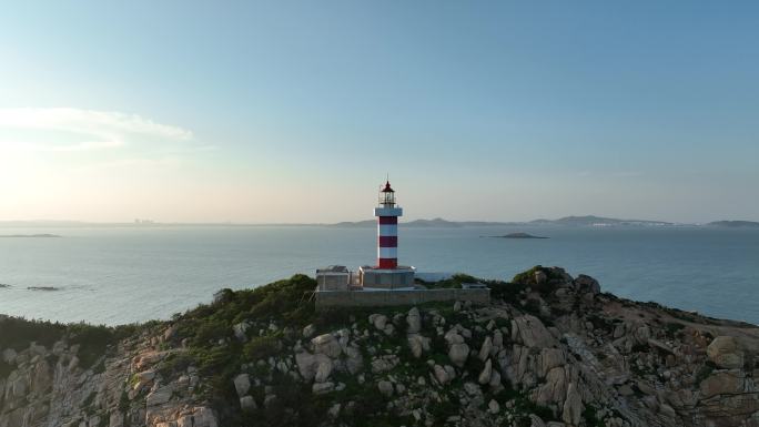 海上灯塔航拍海洋风车发电大海日出阳光海面