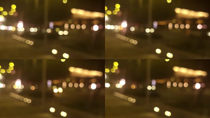 夜间散焦的城市交通灯