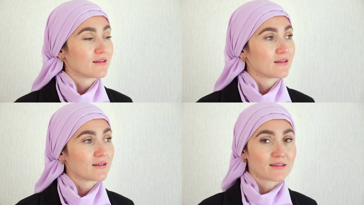 一名穆斯林妇女带着兴奋的表情在演播室里环顾四周