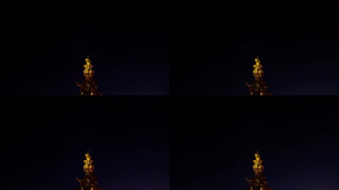 夏夜峨眉山金色普仙佛像前景的移动星星4k延时镜头。