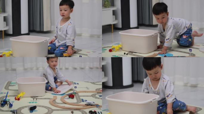 孩子在家玩玩具火车轨道