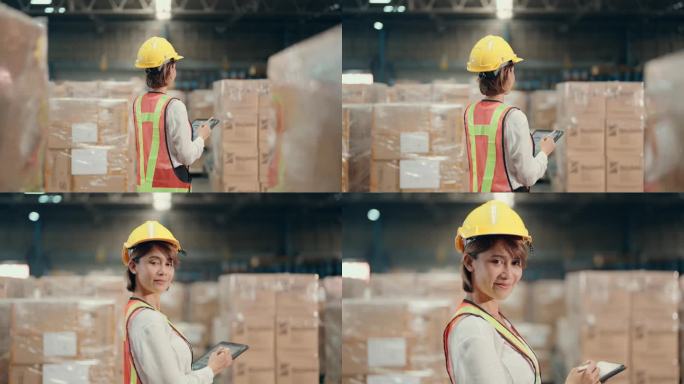 微笑的亚洲女性仓库工人在工业环境中被授权和自信
