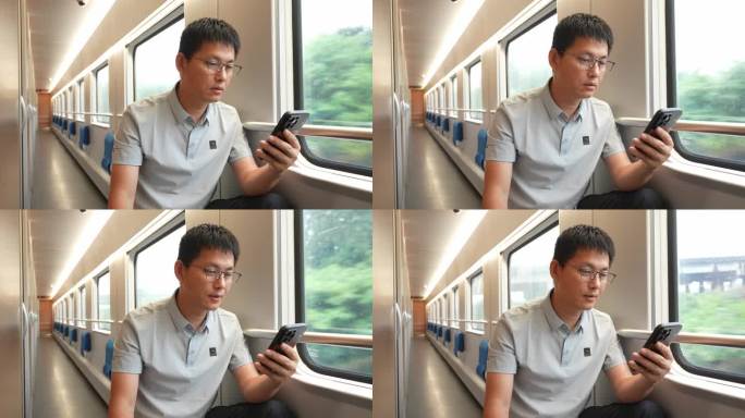 男子在卧铺火车过道上使用手机