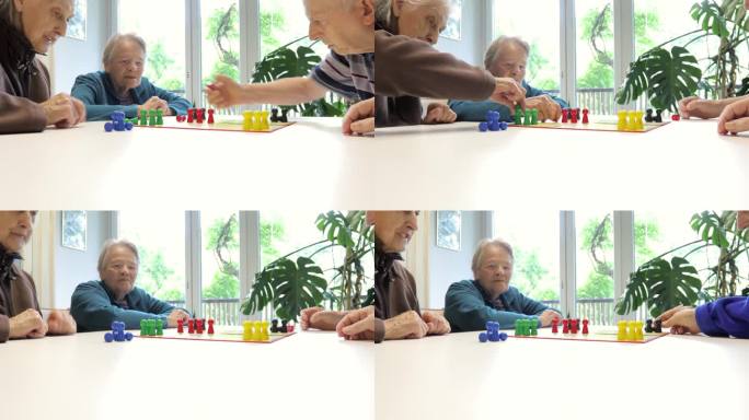 一群老年人在养老院玩棋盘游戏