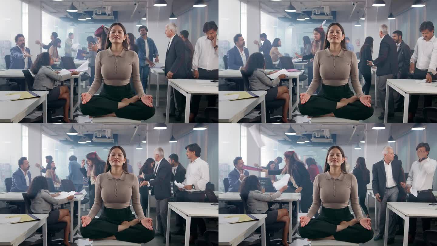 年轻的印度公司女性在繁忙混乱的办公室中摆出沉思的姿势