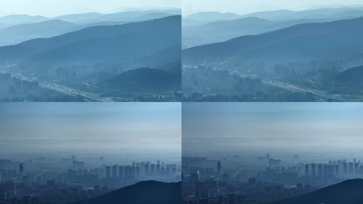 航拍雾霾里的城市和山脉