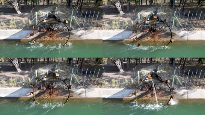 摩天轮从河里取水灌溉的4k视频