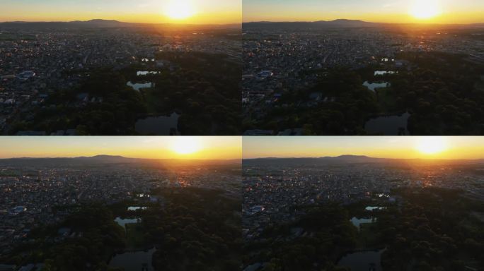 无人机跟踪拍摄奈良公园与阳光城市背景，日落在日本