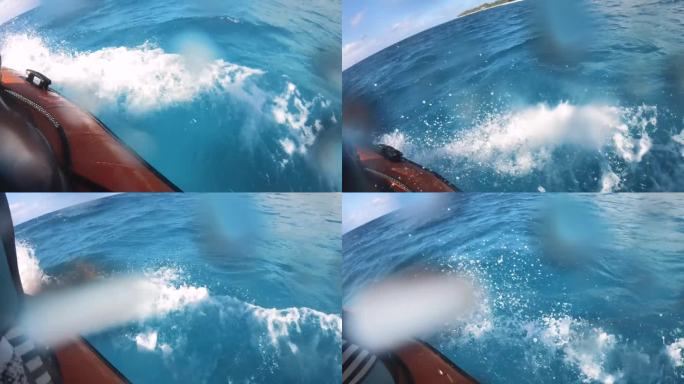 海浪看在一个速度救生筏船与海洋海水溅起涟漪滴到相机镜头与地平线在蓝天多云的好天气与阳光在南太平洋