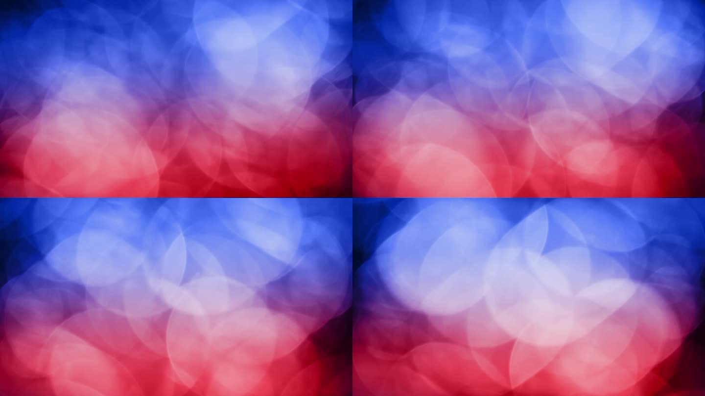 混合蓝色和红色散景背景流动运动和色彩平衡在一个多色辉光。蓝红色散景效果辐射软焦点和环境光为一个充满活