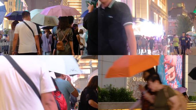 城市夜晚下雨天雨景人流夜景行人过马路街景