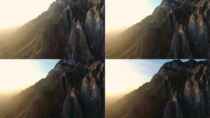 空中拍摄的山脊与太阳耀光，河谷，波特罗奇科，伊达尔戈登山，阳光，伊达尔戈附近的绿色山脉，伟大的攀岩，