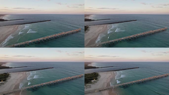 鸟瞰图抽沙码头吐在黄金海岸在昆士兰州，澳大利亚在日落-无人机拍摄