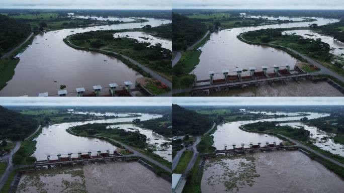 混凝土坝泄洪道泄洪鸟瞰图是雨季泄洪的一种方式。从泰国一座大坝流出的浑浊棕色森林水的俯视图。