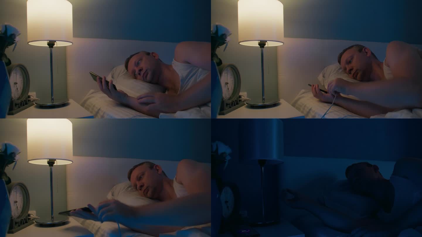 男人在晚上睡觉的时候给手机充电