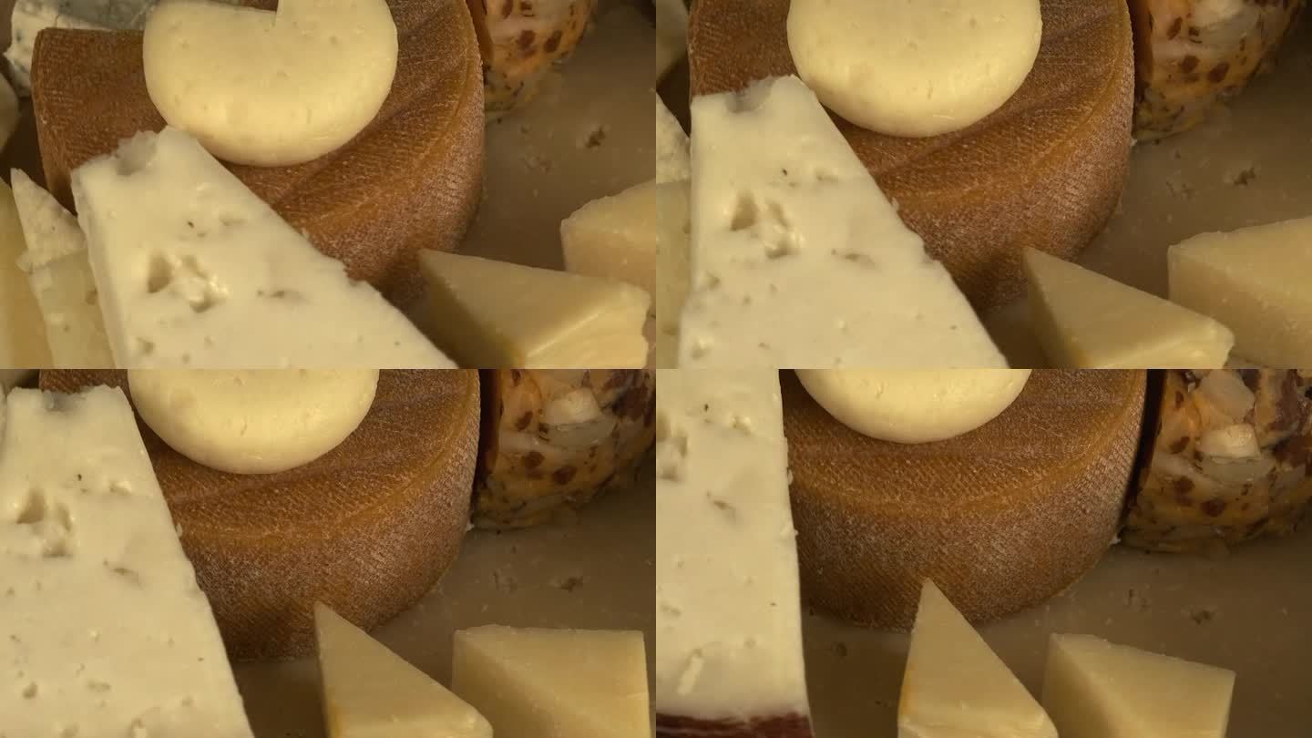微距窄焦特写各种奶酪在盘子上旋转