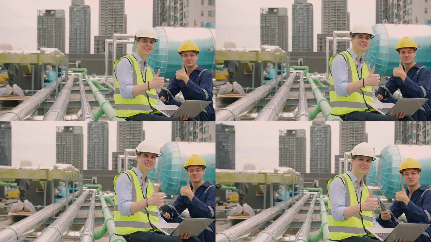 英俊的白人土木工程师，建筑经理和工人督察工头戴着安全帽，在施工现场看着摄像头，竖起大拇指，微笑着