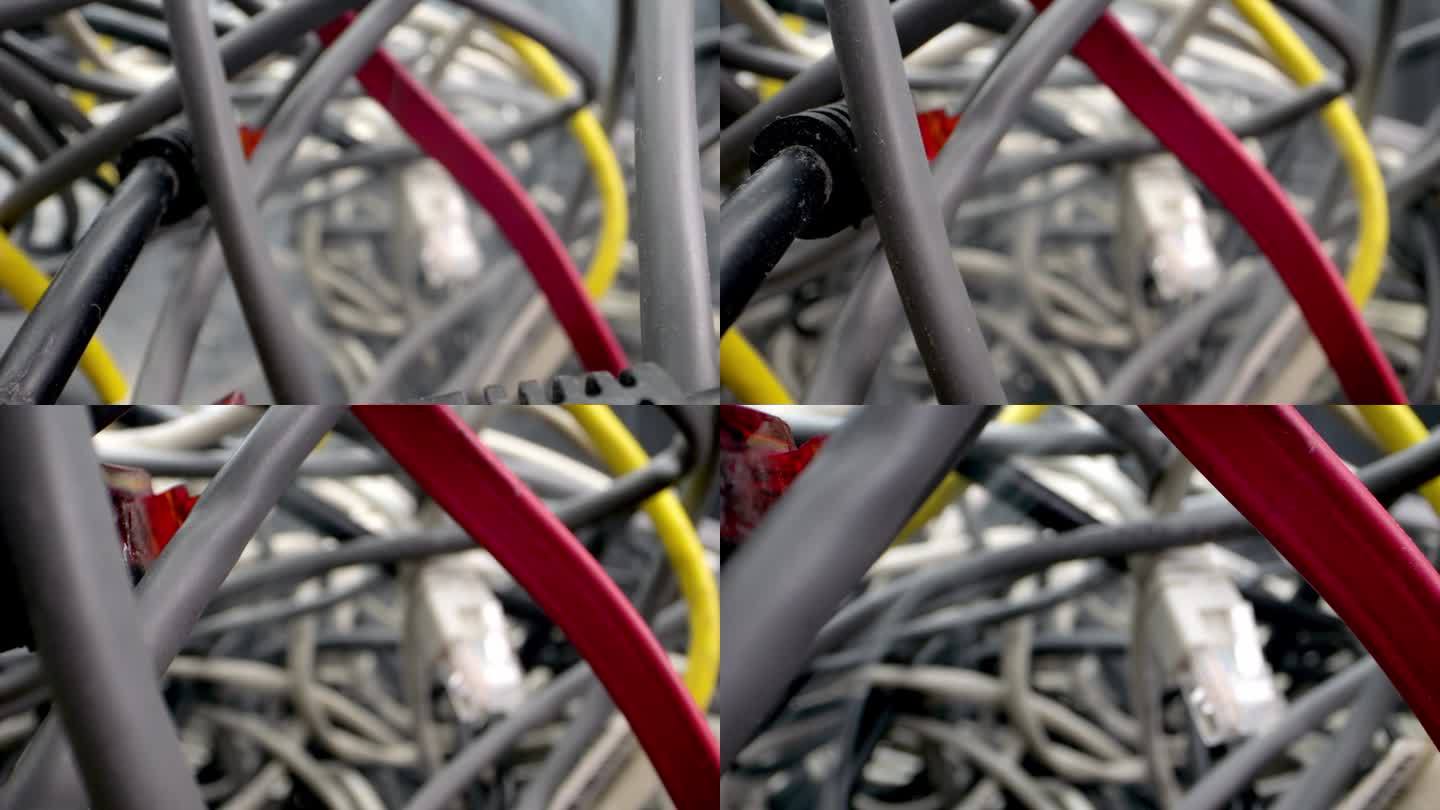 摄像机镜头穿过错综复杂的网线和其他障碍物。电线拆卸，电脑故障，看到可能出现短路或起火的烟雾。