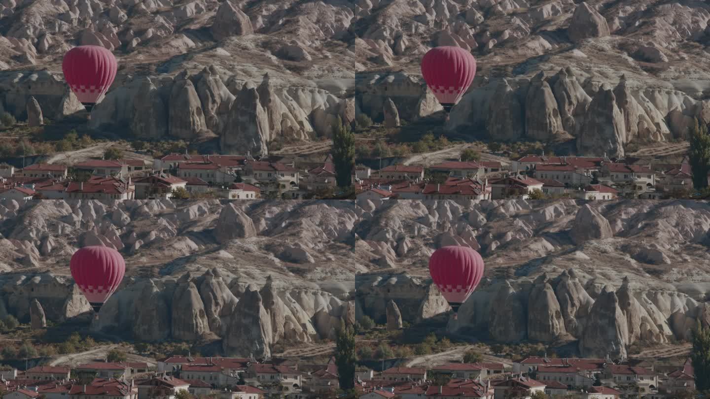 房子上方山谷里的红气球