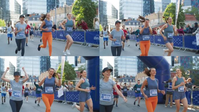 妇女支持妇女:参加马拉松比赛的快乐女跑步者的慢镜头。一群朋友一起庆祝，互相祝贺越过终点线