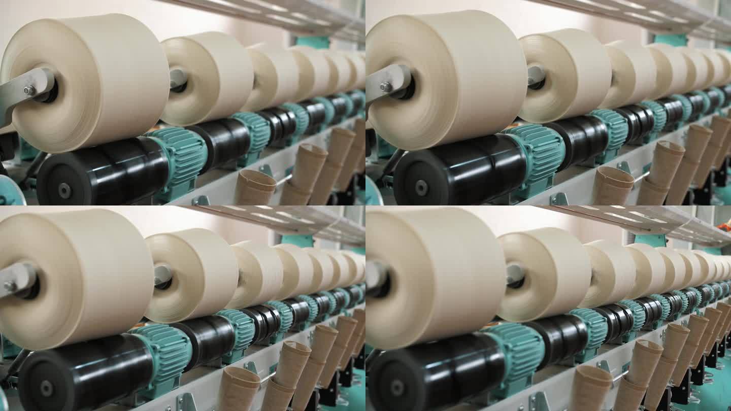 近距离的纱线线轴。线生产。纺织工厂。纺纱生产。纱线制作工艺。纺织厂设备。