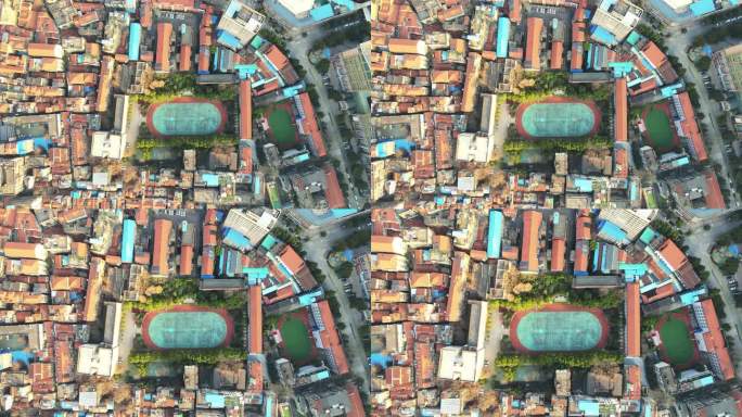 航拍武汉城市老城区建筑群环绕的学校校园