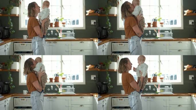 妈妈，孩子和在厨房跳舞作为一个家庭一起爱，信任或支持他们的家。家庭，孩子和一个女人在公寓里亲吻她的婴