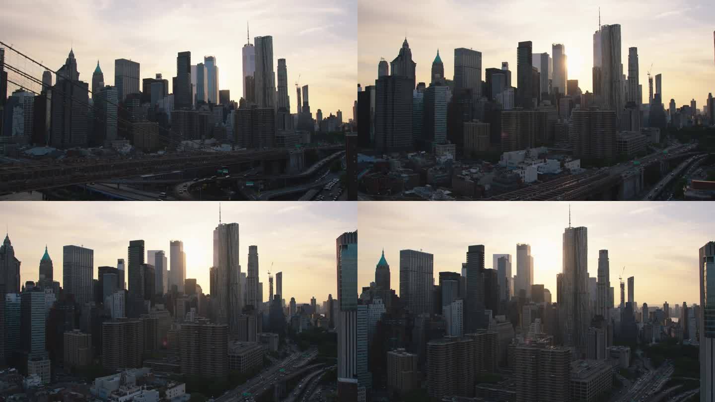 从纽约市中心俯瞰。曼哈顿区和布鲁克林大桥鸟瞰图。电影般的城市景观，傍晚的阳光穿过摩天大楼和城市街道