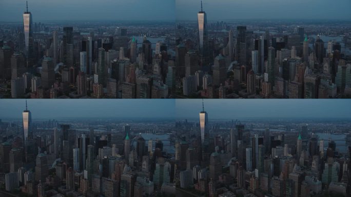华尔街办公大楼的夜景:纽约曼哈顿下城建筑的空中风景。全景金融区镜头从直升机。摩天楼夜景