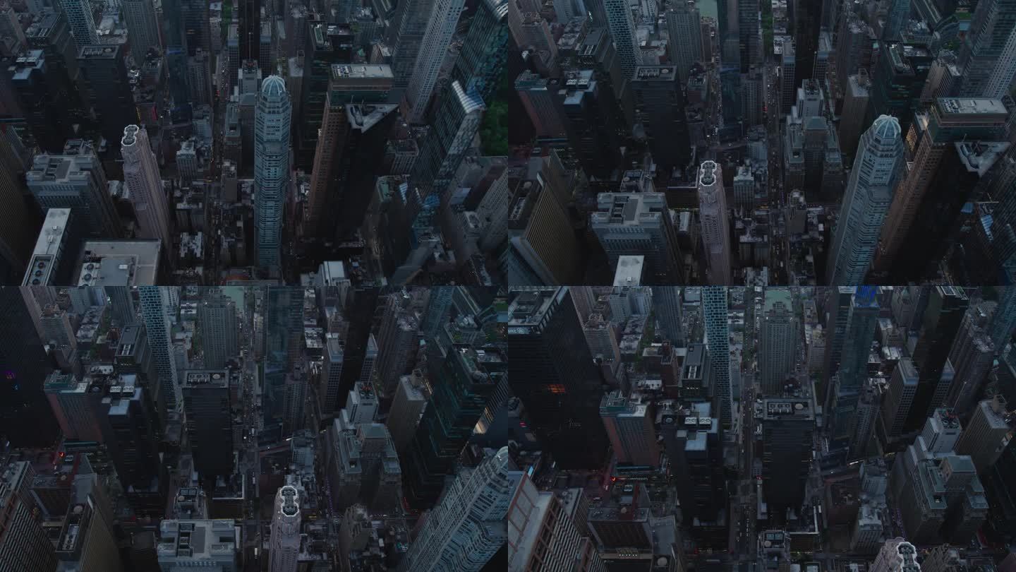 电影直升机镜头移动对角线在纽约市的街道网格系统。拥挤的大街、道路、汽车、夜生活和高大的现代摩天大楼
