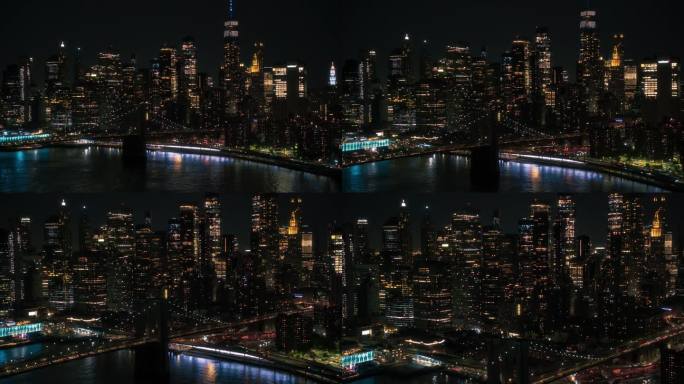 纽约市中心夜景。曼哈顿下城和布鲁克林大桥鸟瞰图。有摩天大楼的电影城市景观，有灯光的办公楼，有汽车和交