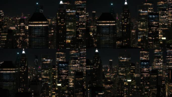 直升机夜游纽约市。鸟瞰图与一个风景如画的照明办公大楼，风景与曼哈顿摩天大楼全景