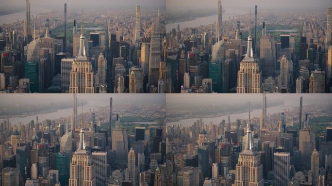 纽约市和曼哈顿全景城市景观与帝国大厦的航拍镜头。以中央公园和哈德逊河为背景的旅游景点的直升机视图