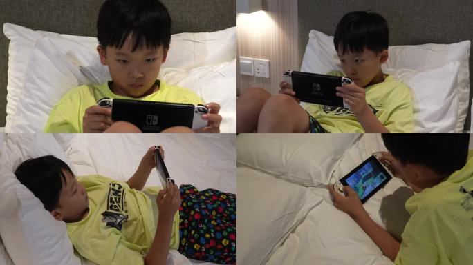 儿童小学生在床上玩swich游戏机4k