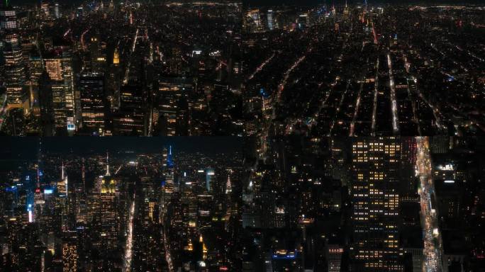 航拍超高速夜间镜头穿过曼哈顿下城与办公大楼的夜晚。华尔街、帝国大厦和时代广场的移动延时锁
