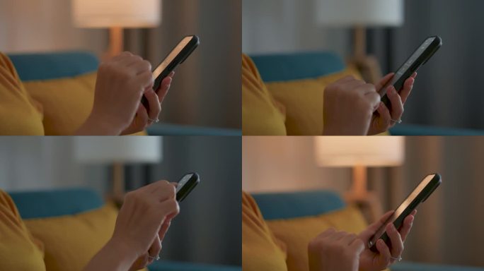 女性用智能手机开灯的特写镜头。